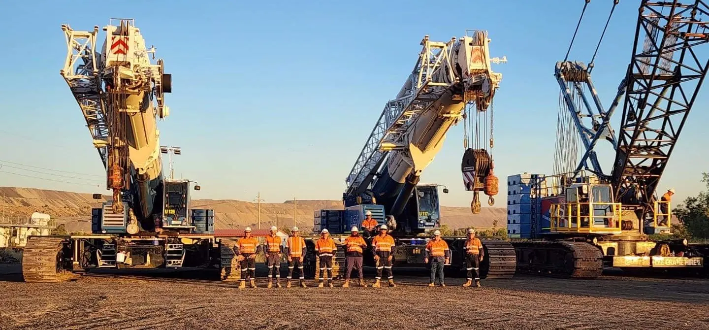 The LCH team standing in front of the crane fleet