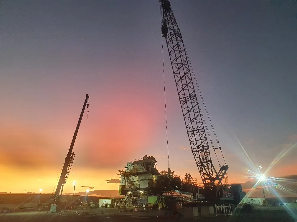 LCH cranes working at dusk on a project site